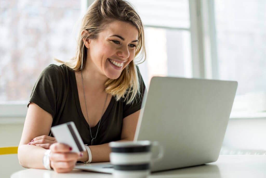 Woman smiling on Computer